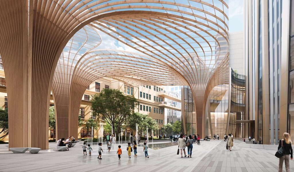 The expansive public courtyard under a modern glazed canopy, with pedestrians walking between the new development and the historic site.