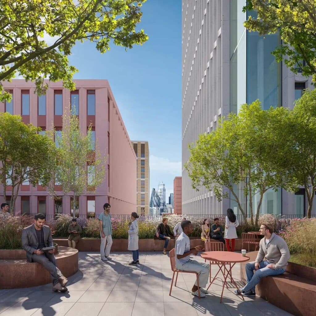 منظر بزاوية مرتفعة لمجمع علوم الحياة في وايت تشابل عند الغسق، مع إضاءة داخلية للمباني وأسطح ذات مناظر طبيعية.