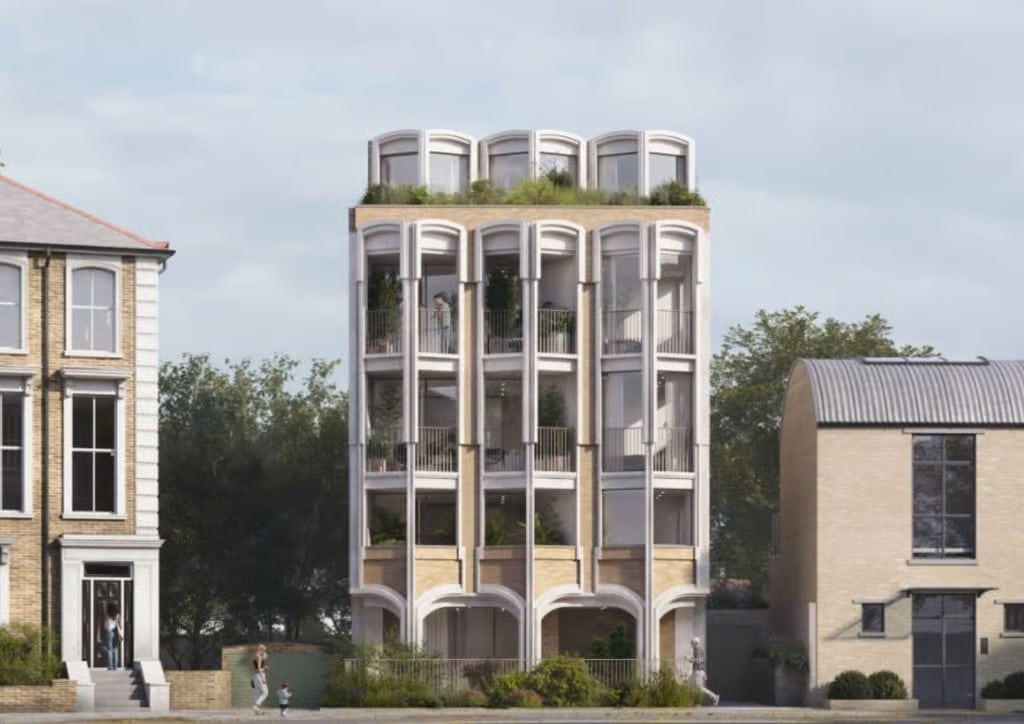 Close-up detail of the revised facade for the Camden flats, showing the brickwork and Victorian-inspired balcony balustrades.