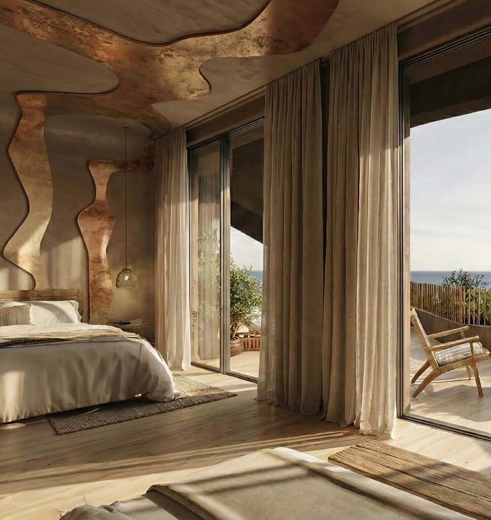 Bedroom interior design featuring organic ceiling patterns and floor-to-ceiling windows opening onto a private sea-view terrace.