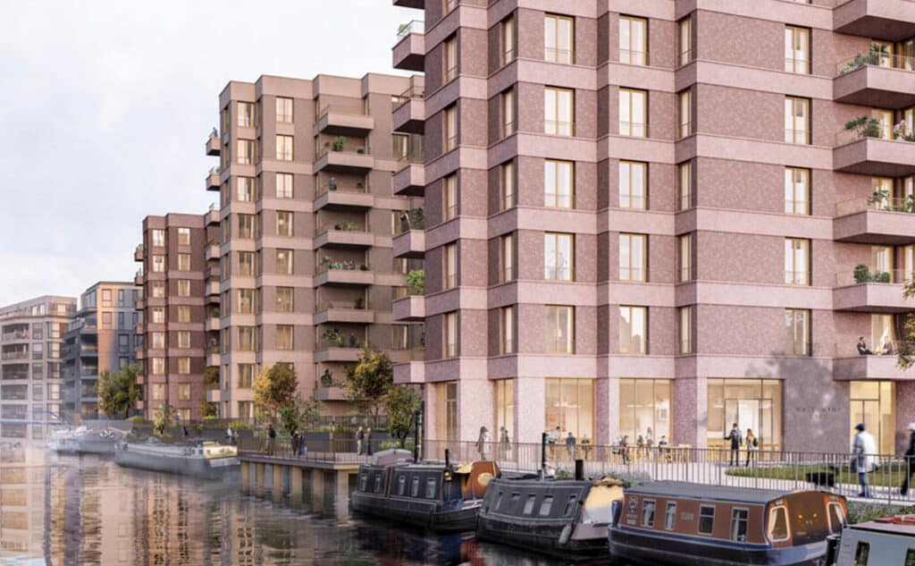 Riverside view of the Brentford residential development reflecting in the canal water during the evening.