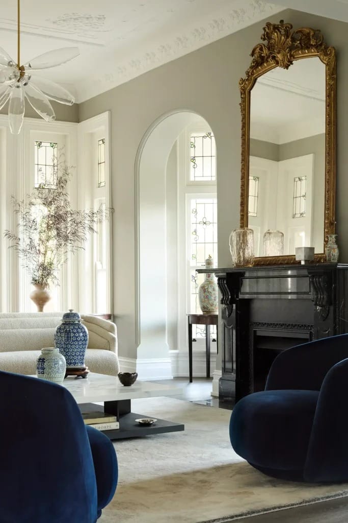 Interior view of the Sydney Hidden Home showing the blend of modernist furniture with the original late Victorian architectural details.