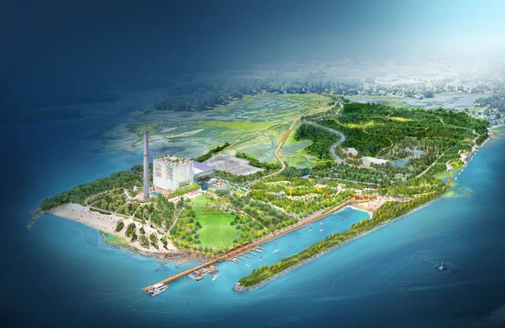 لقطة جوية شاملة لمخطط مانريسا وايلدز العام تظهر الجزيرة بالكامل، والساحل، والرصيف البحري، ومحطة الطاقة المحفوظة، والمساحات الخضراء الشاسعة.