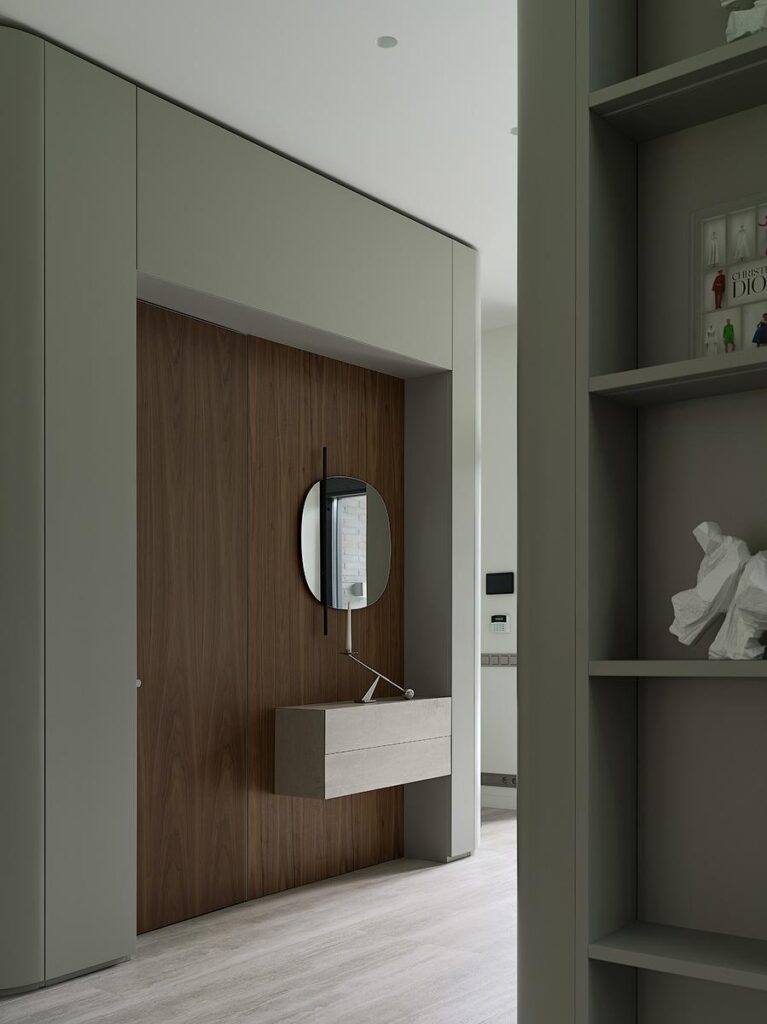 Entrance hall interior featuring Calligaris Vanity mirror, Poliform Plus wardrobe, and Salvatori natural stone niche finish