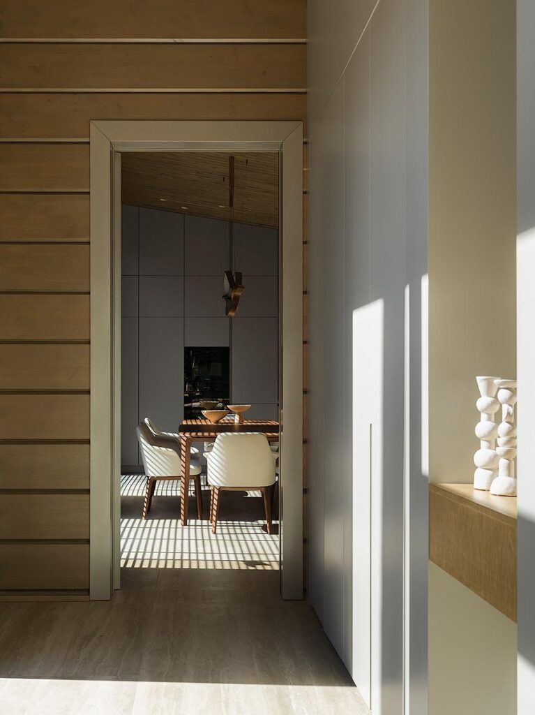 Entrance hall interior featuring Poliform New Entry wardrobes, Salvatori natural stone niche, and Nature Deco blinds