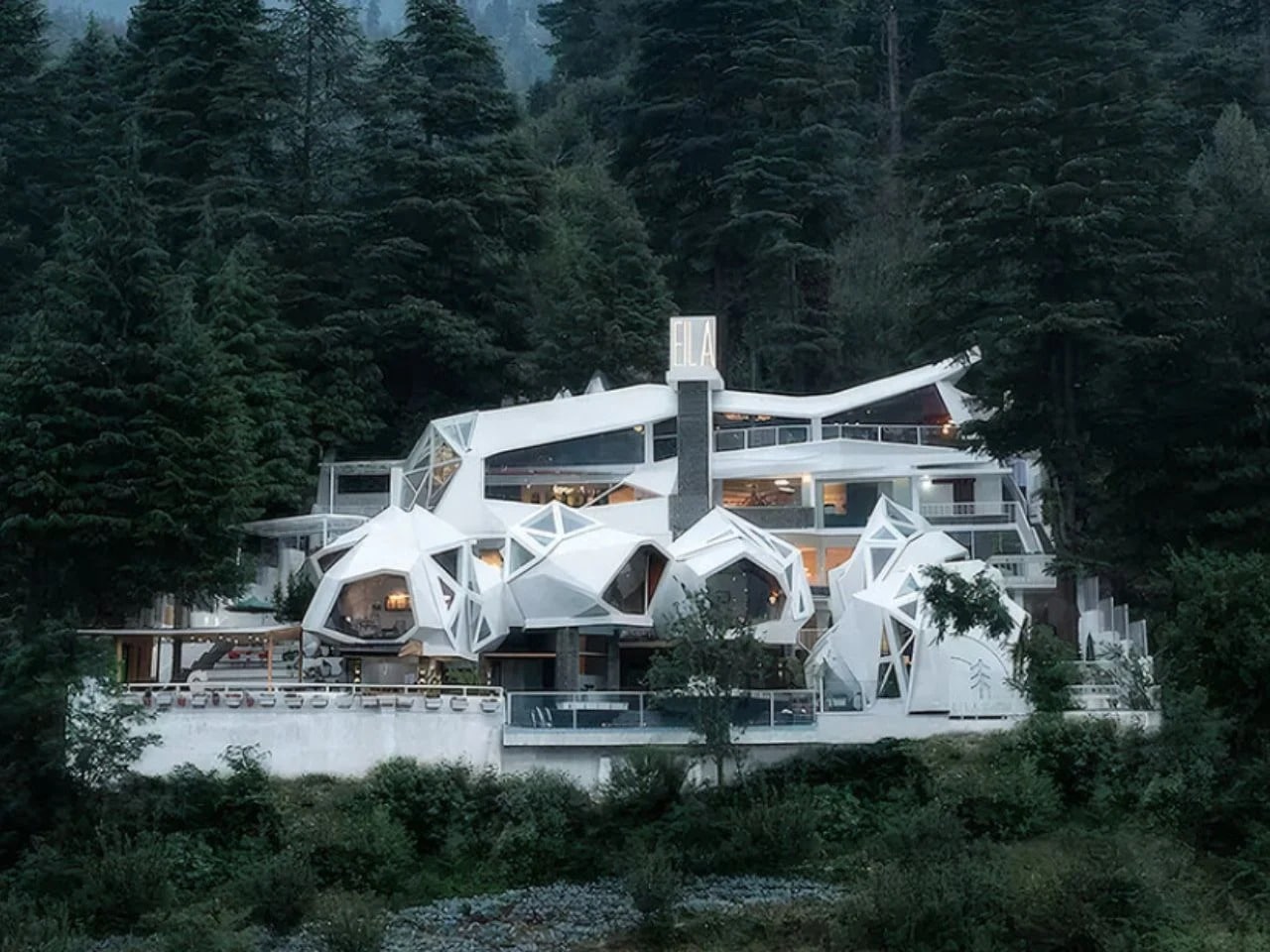 Exterior view of Ayla resort featuring white biomorphic pods nestled in the dense pine forests of Nagar Valley, Himachal Pradesh.