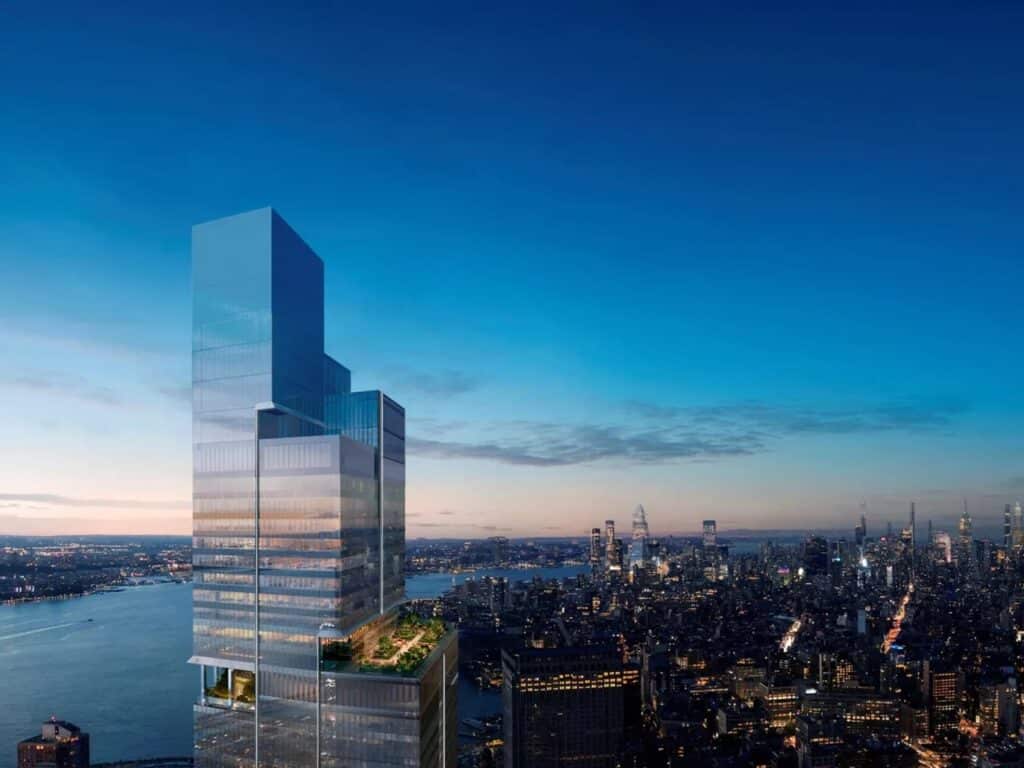 Aerial evening view of 2 World Trade Center with a large outdoor terrace garden overlooking the New York City skyline and Hudson River.