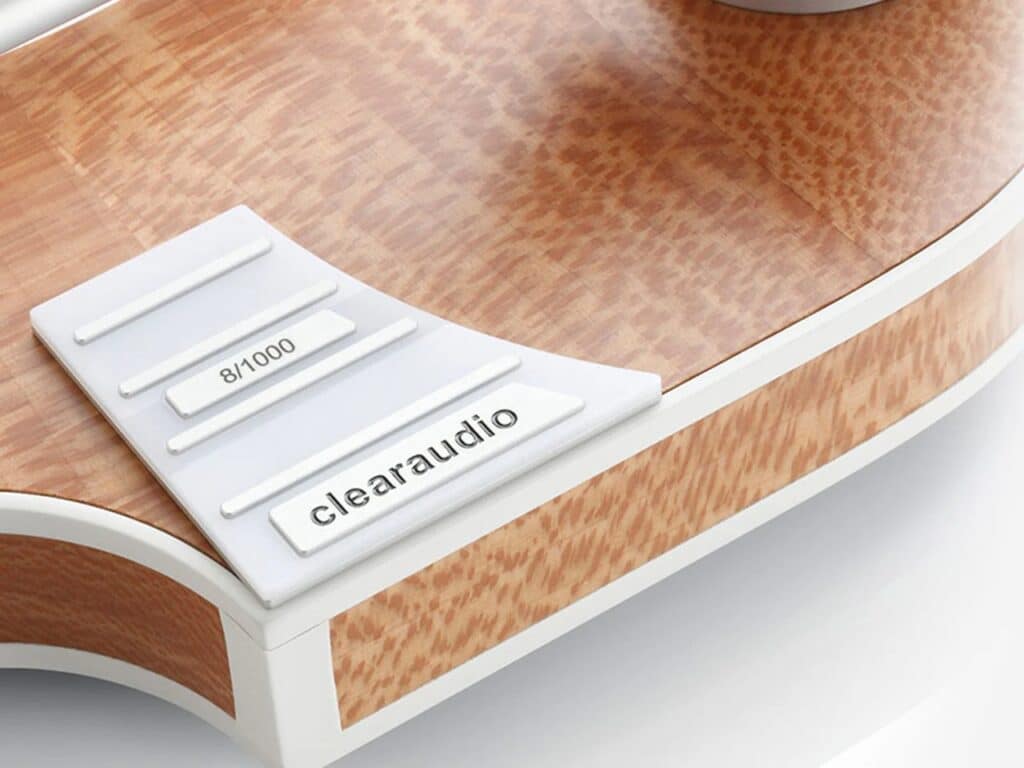 Detail shot of the limited edition numbering and brand logo on the wood grain surface of a high-end turntable.