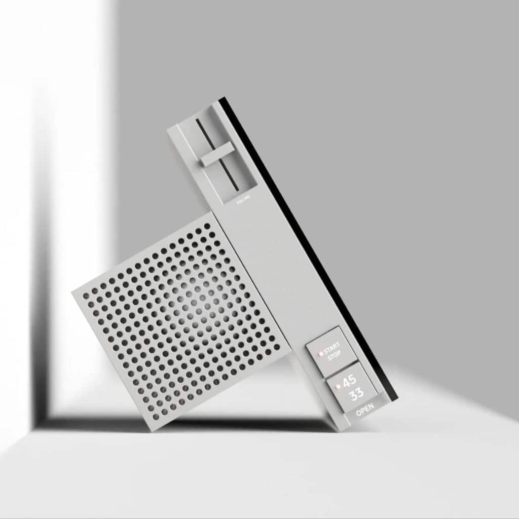 Side view of a grey vinyl player concept showing the minimalist control interface, volume slider, and perforated speaker texture.