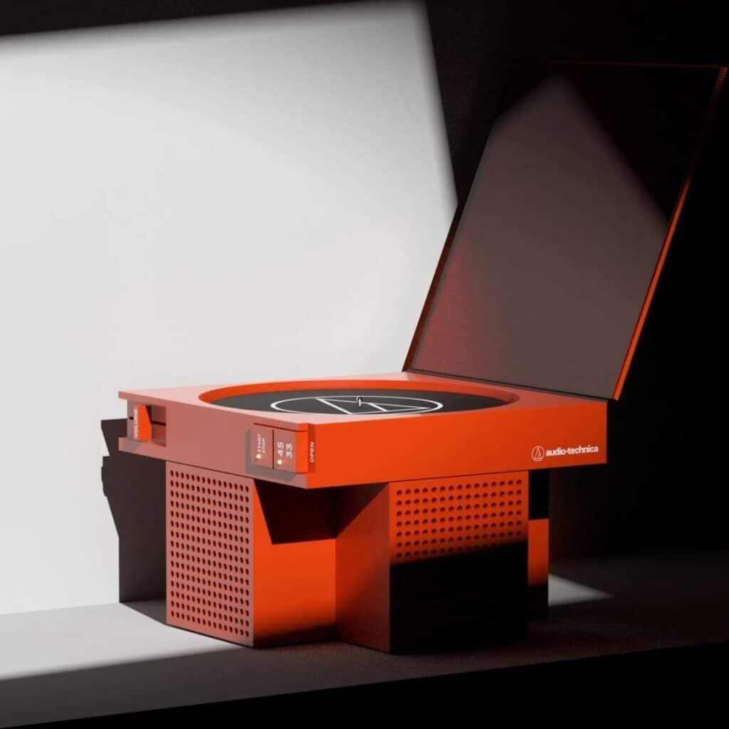 A vibrant orange-red vinyl player concept with an open lid, featuring a perforated base and minimalist branding under dramatic lighting.