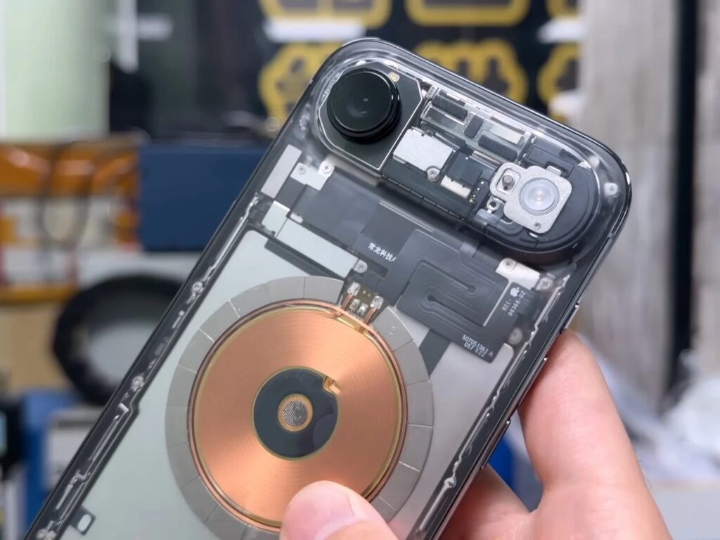 Detailed view of the upper camera module and internal flex cables of a deconstructed iPhone.