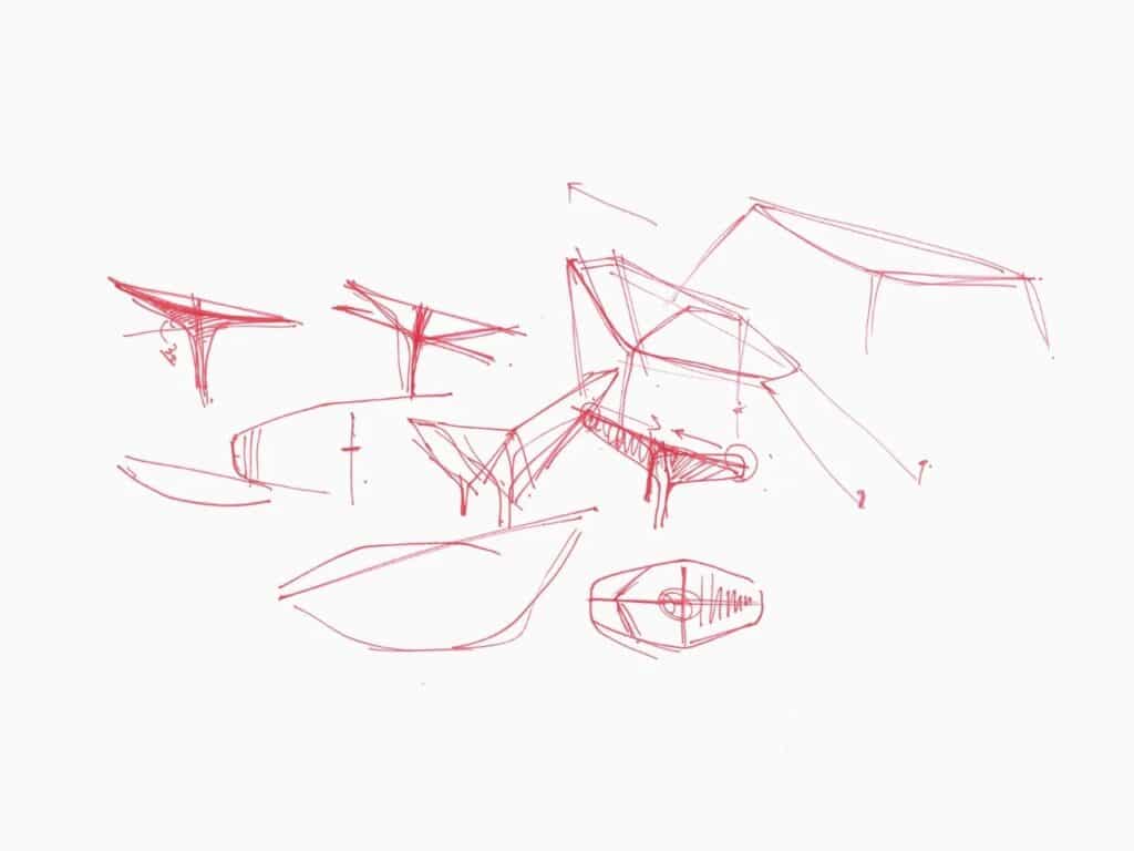 Early red ink sketches of Seoul Wing showing various iterations of wing angles and structural proportions.