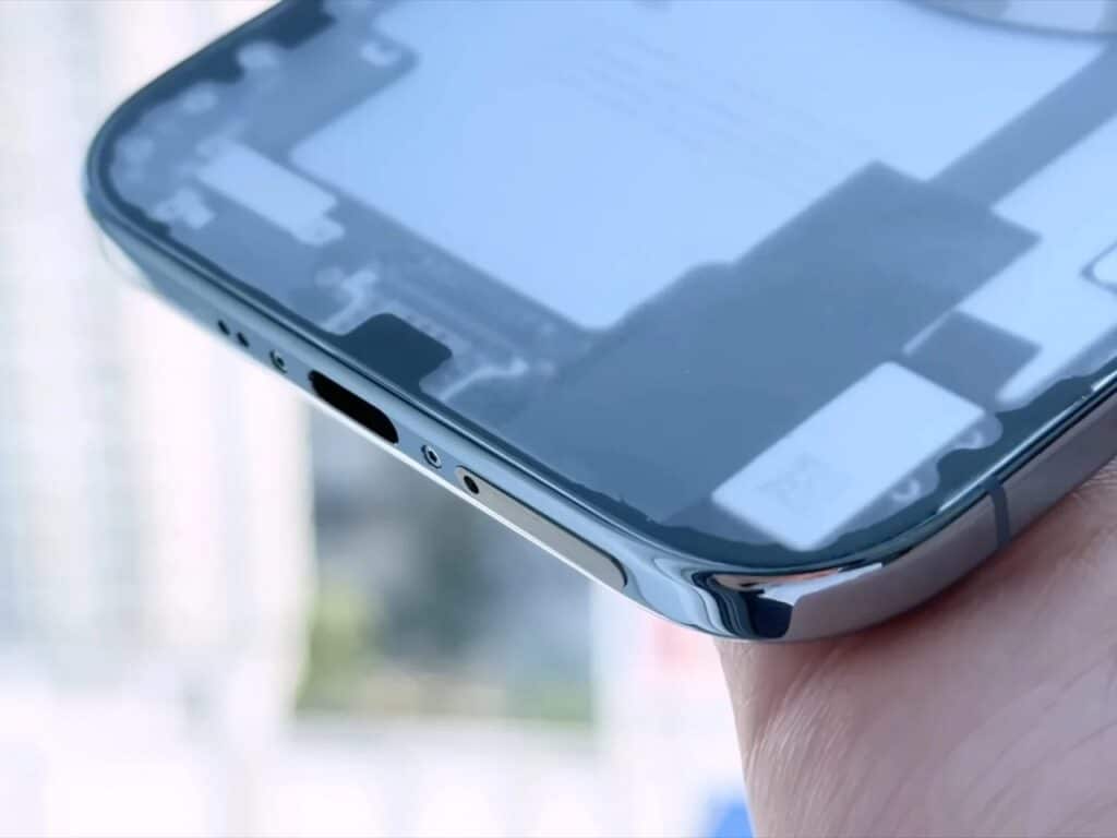 Macro shot of the USB-C port and bottom frame of a modified iPhone.