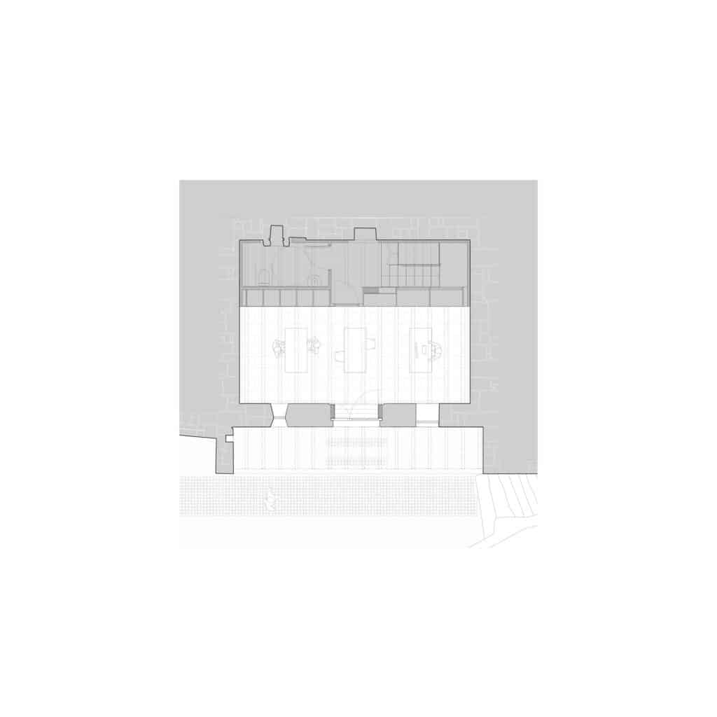 Architectural floor plan of the rehabilitated stone house showing the layout of the main social spaces and facilities.