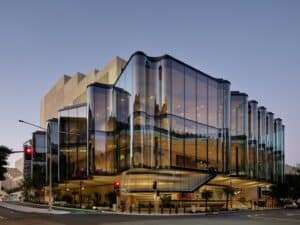 Glasshouse Theatre exterior showing its rippling glass facade on a Brisbane street corner
