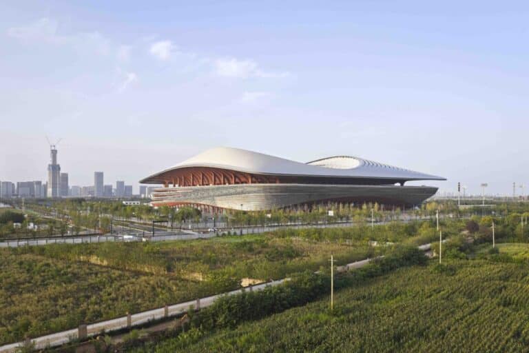 Exterior view of the Xi'an International Football Centre showcasing its saddle-shaped roof and modern stadium architecture.