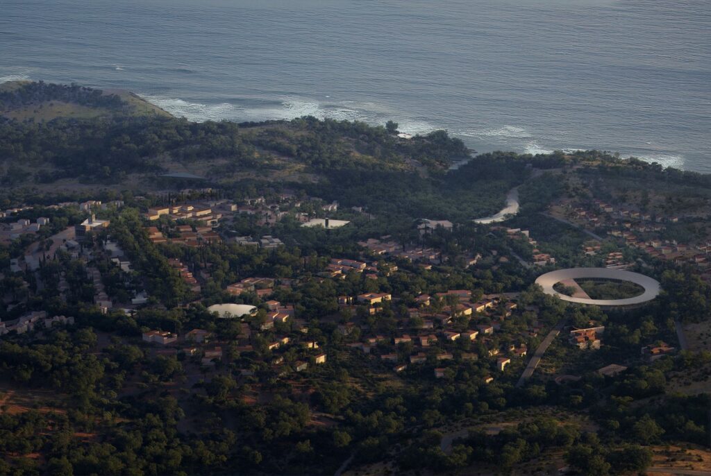 Wide coastal view of the Beykoz neighborhood development featuring the circular structure and the Black Sea.