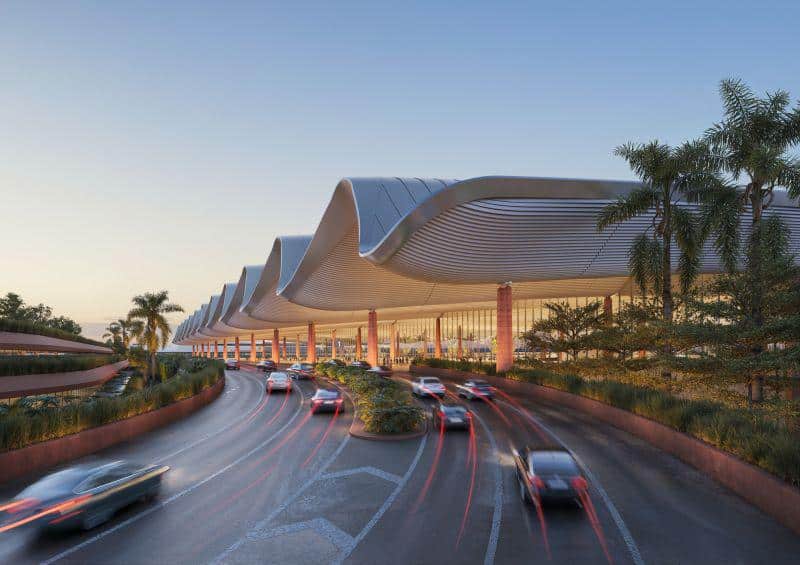 Cars arriving under the sweeping entrance canopy of Gia Binh Airport terminal