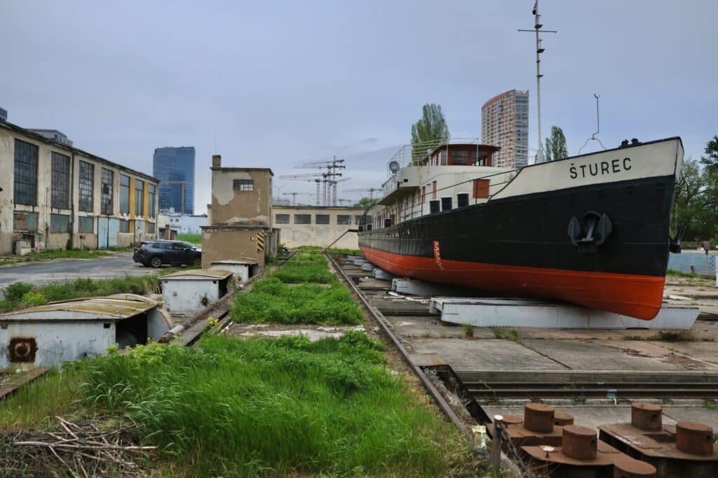 Historic tugboat &Scaron;turec at Winter Harbour Bratislava highlighting the transformation of the Zimn&yacute; pr&iacute;stav waterfront district.