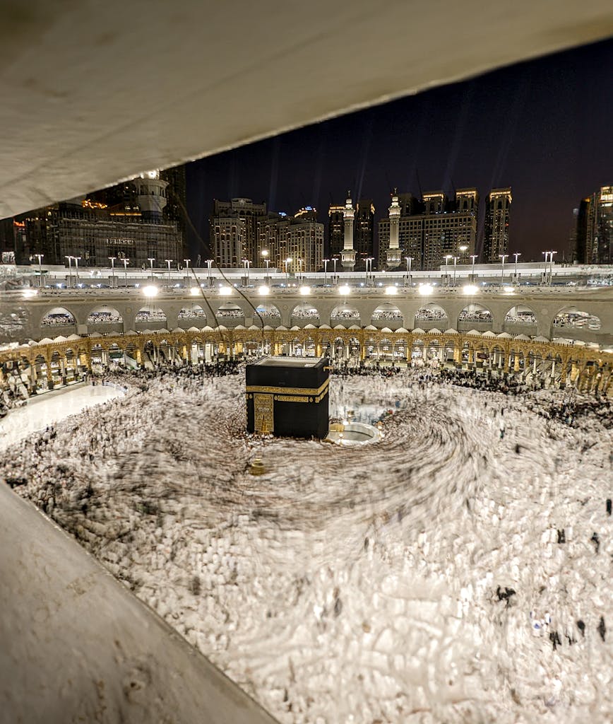 Aerial view of the Kaaba in Masjid al-Haram, Makkah, Saudi Arabia, at night.