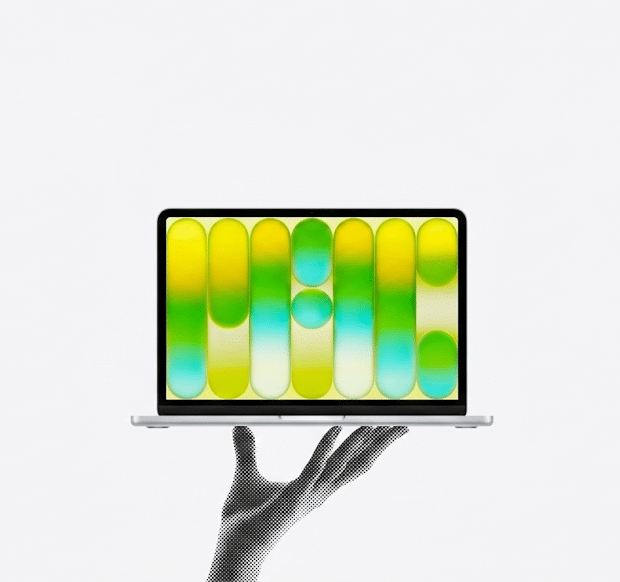 A stylized black-and-white halftone hand holding a modern laptop, which displays a vibrant abstract graphic of yellow, green, and blue gradient pill shapes against a white background.
