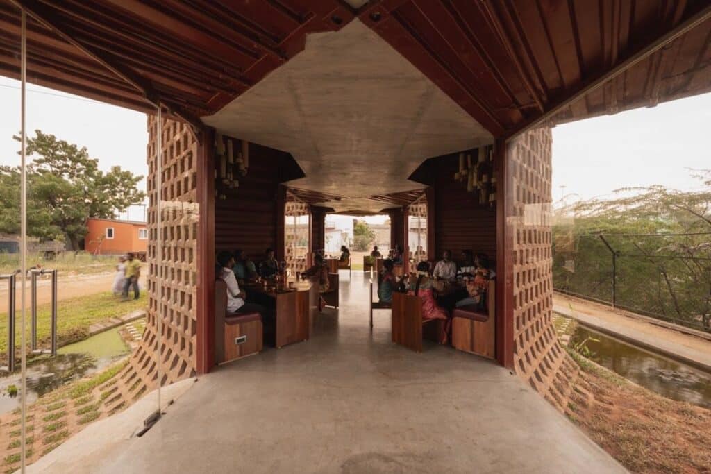 Interior view of Petti Restaurant showing the raw industrial texture of the containers and communal seating areas.