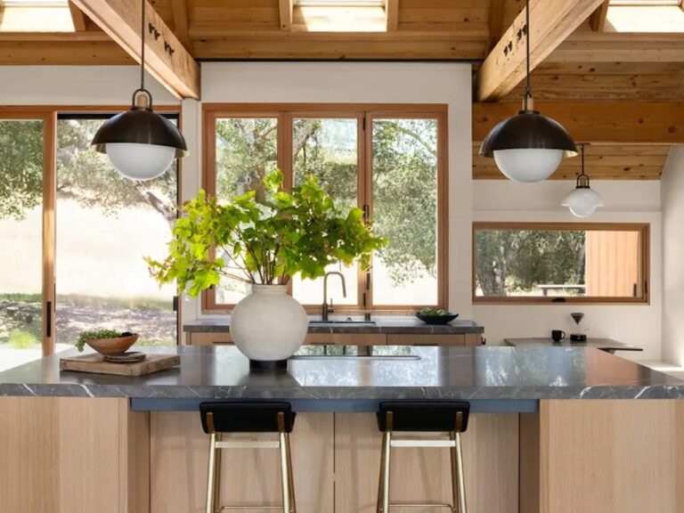 Modern kitchen island with marble countertop and pendant lighting in Glen Ellen house, Sonoma.