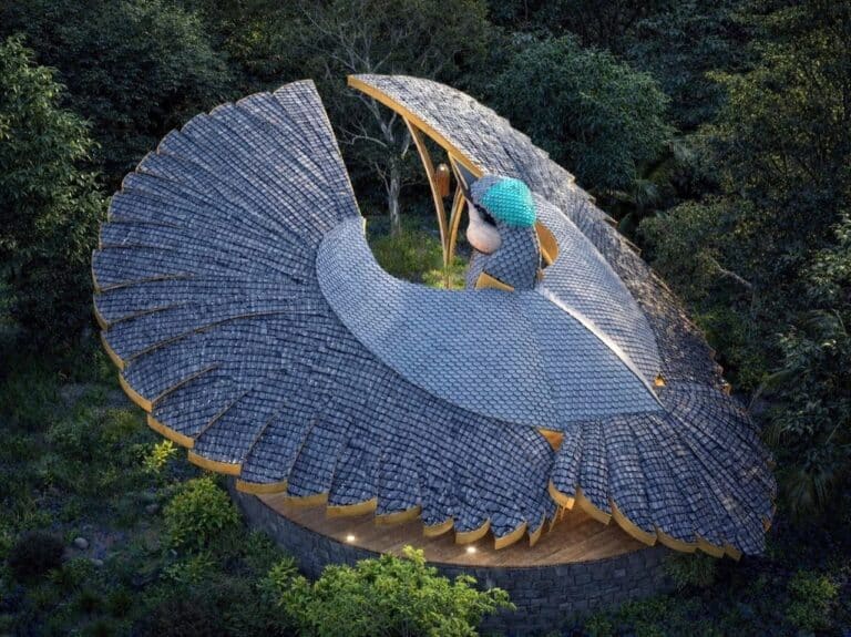 Aerial top view of Rifle Bird Yogashala pavilion showing the bamboo shingle roof mimicking bird wings in a forest.