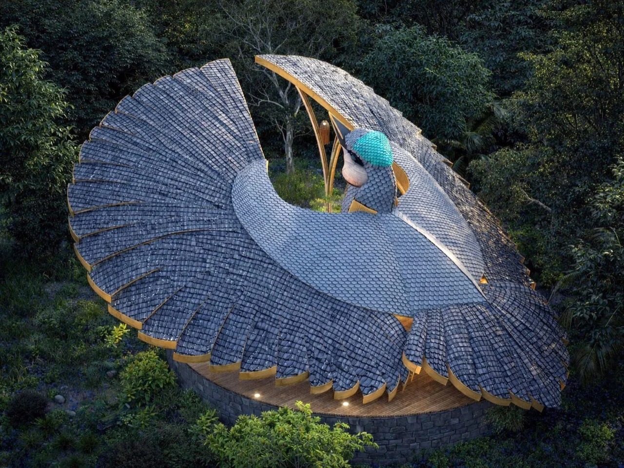 Aerial top view of Rifle Bird Yogashala pavilion showing the bamboo shingle roof mimicking bird wings in a forest.