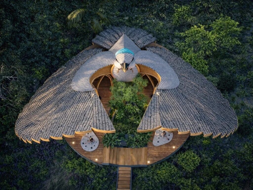 Bird's eye view of the yoga pavilion's symmetrical wing-like structure and central courtyard.