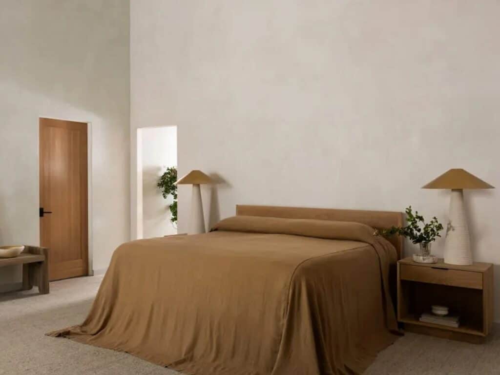 Minimalist master bedroom with neutral tones and soft lighting in the Glen Ellen house.