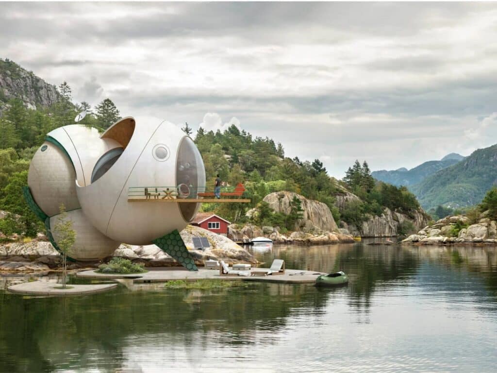 A futuristic spherical cabin with a viewing deck on a rocky Norwegian shore, reflecting solitude and philosophical contemplation.