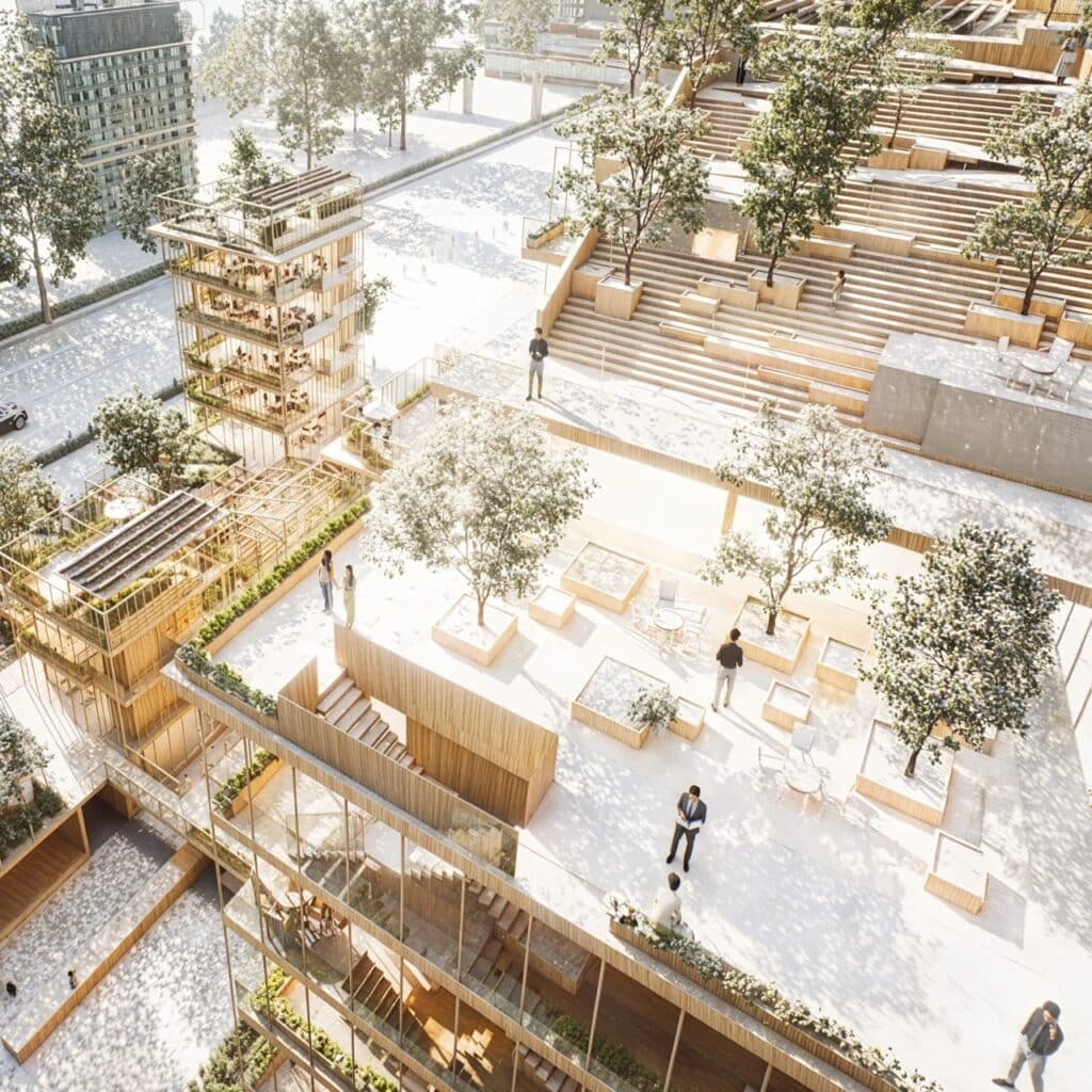 Aerial view of the stepped terraces and social spaces at Verdant Syndicate, showing people interacting in the rooftop gardens.