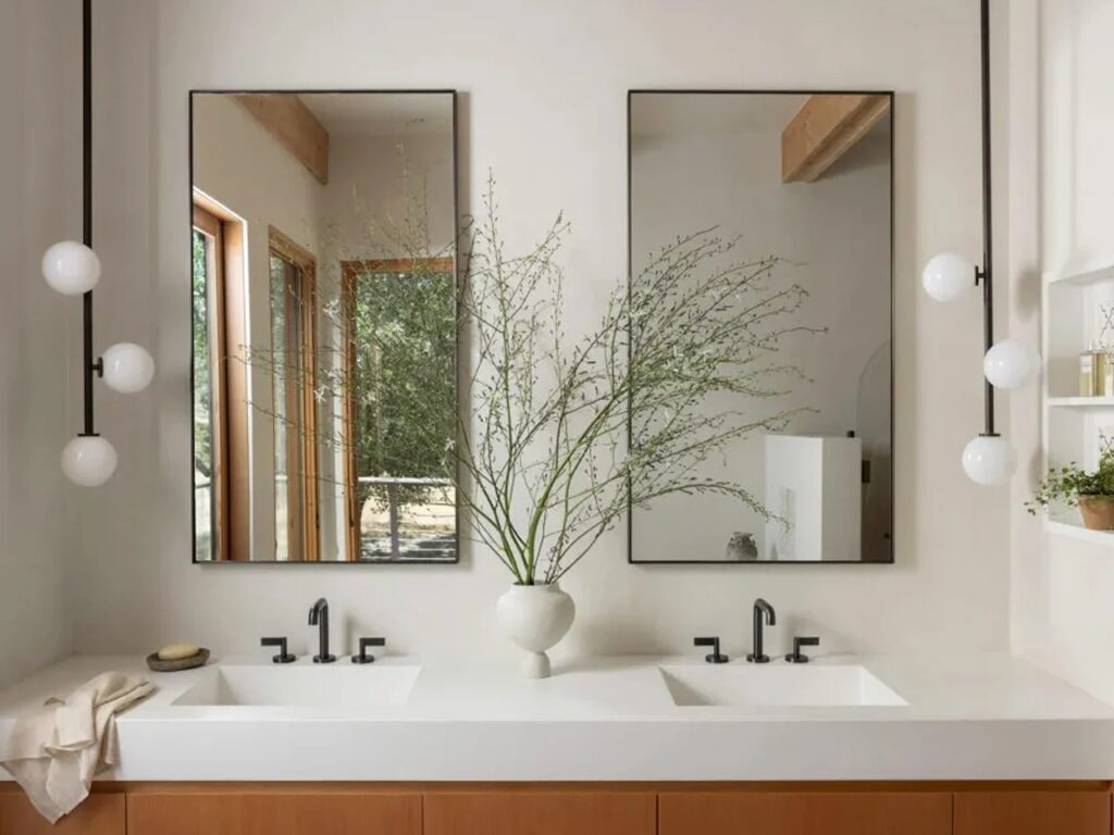 Contemporary bathroom vanity with double sinks and minimalist mirrors in Sonoma residence.