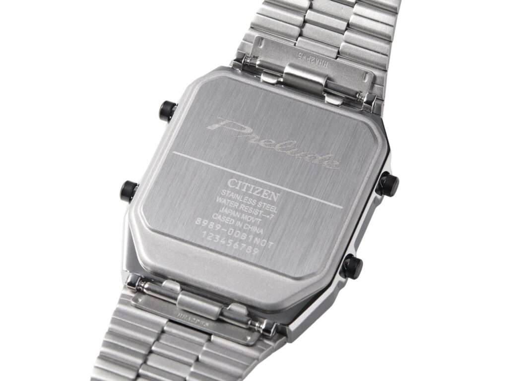 Detailed macro shot of the engraved "Prelude" logo and technical specifications on the watch caseback.