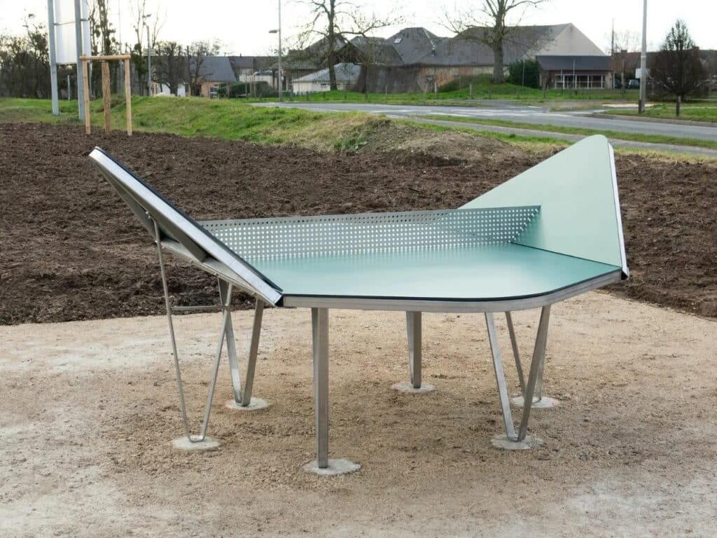 A green ping-pong table with elevated side panels for vertical ball rebound, titled Rebound.