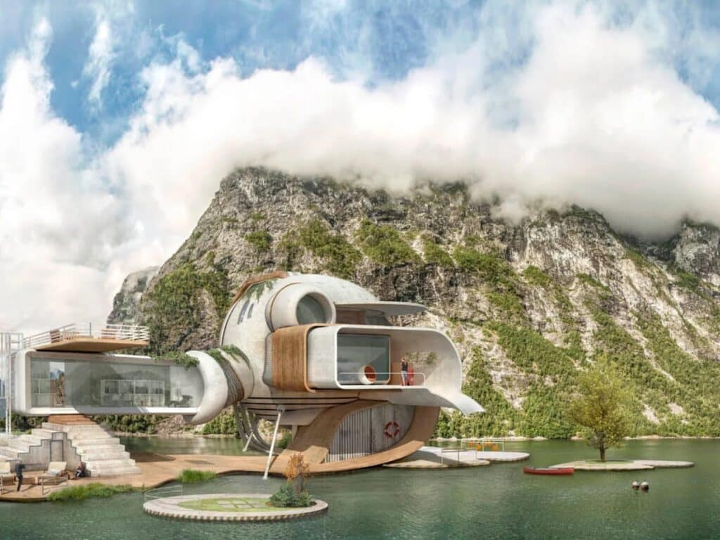 A modern geometric cabin with wood accents and a glass observation room overlooking a fjord and cloud-capped mountain.