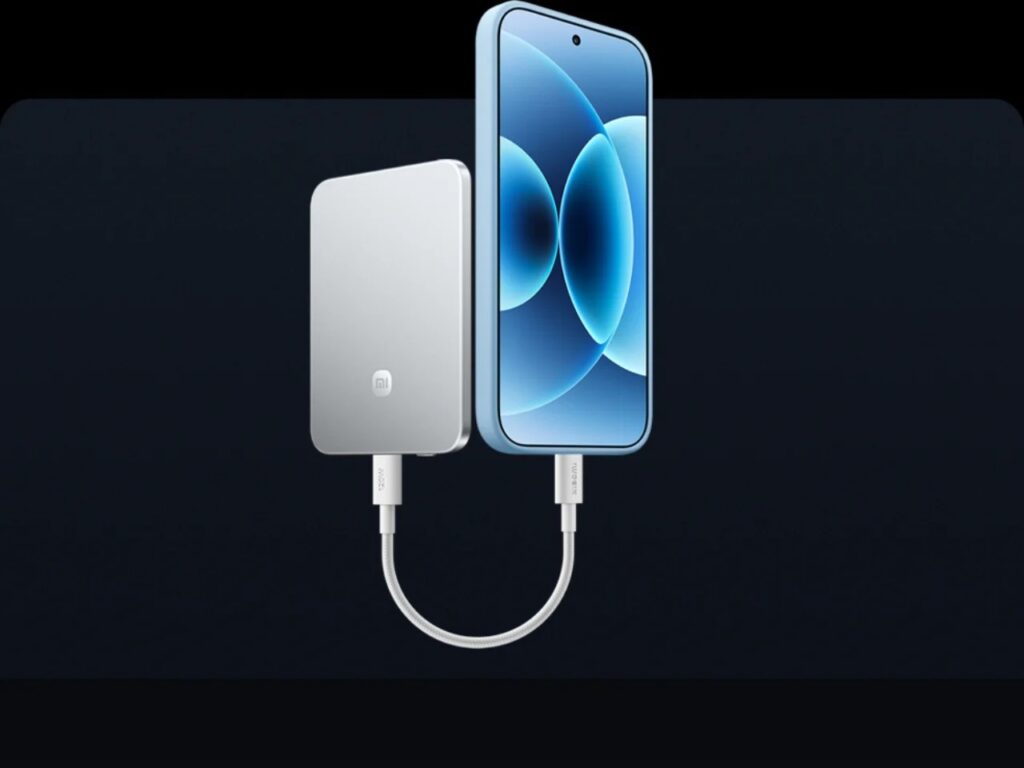 Front view of a smartphone and a power bank connected by a short USB-C cable for wired fast charging.