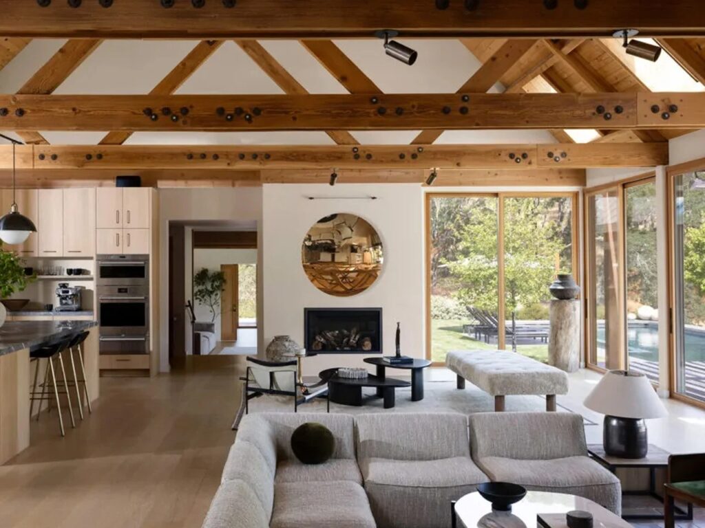 Interior view of the Glen Ellen house showing the exposed wooden truss ceiling and open living areas.