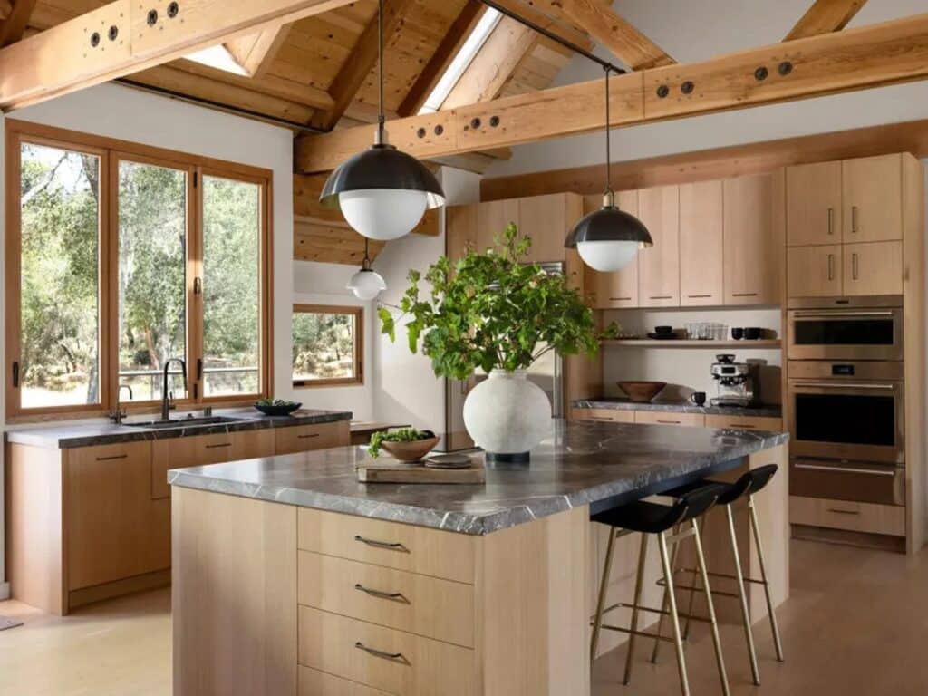 Wide angle of the renovated kitchen with light wood cabinetry and high ceilings in Sonoma.