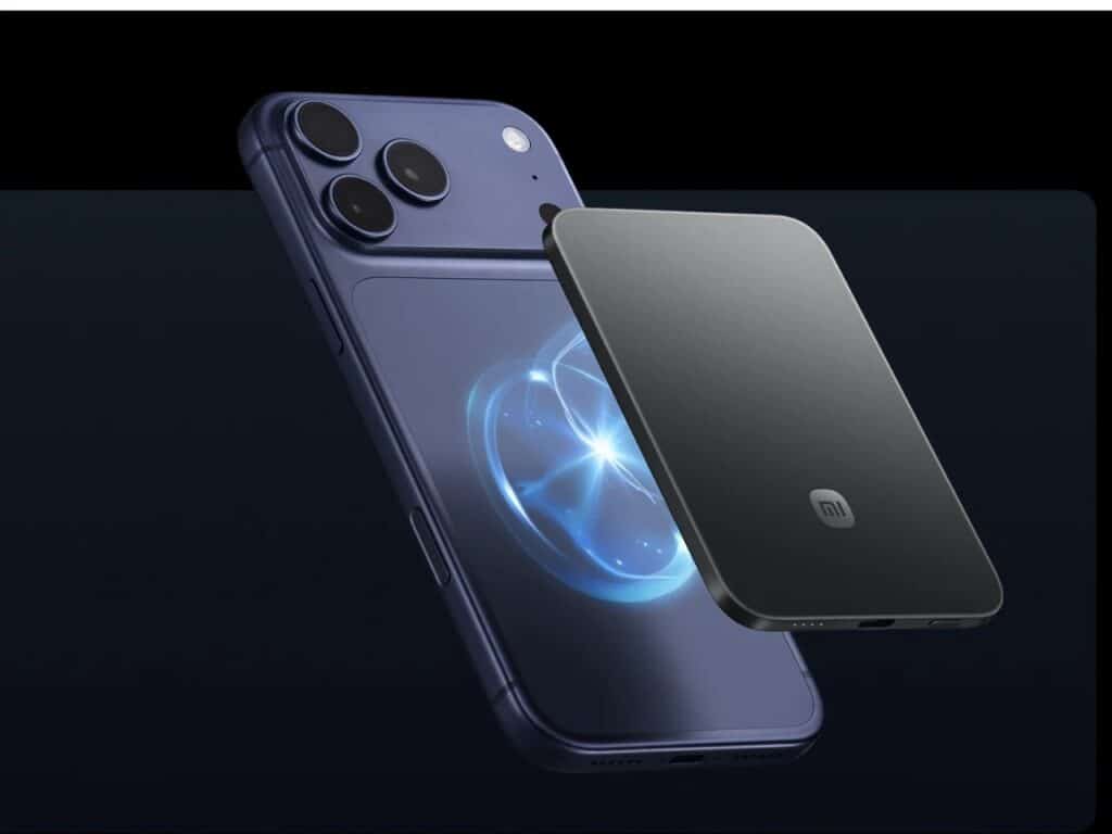 A dark grey magnetic power bank hovering near the back of a purple smartphone, illustrating the magnetic alignment.