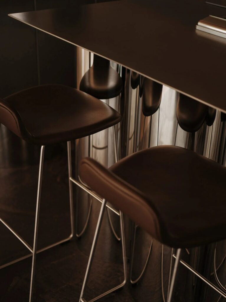 Close-up of leather bar stools and reflective metal surfaces in WatchHouse interior.