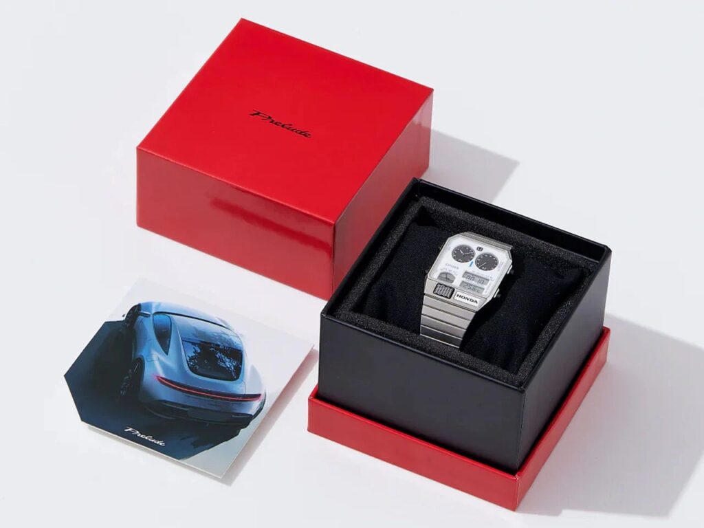 Citizen Ana-Digi Temp watch in its red and black packaging with a Honda Prelude concept card.
