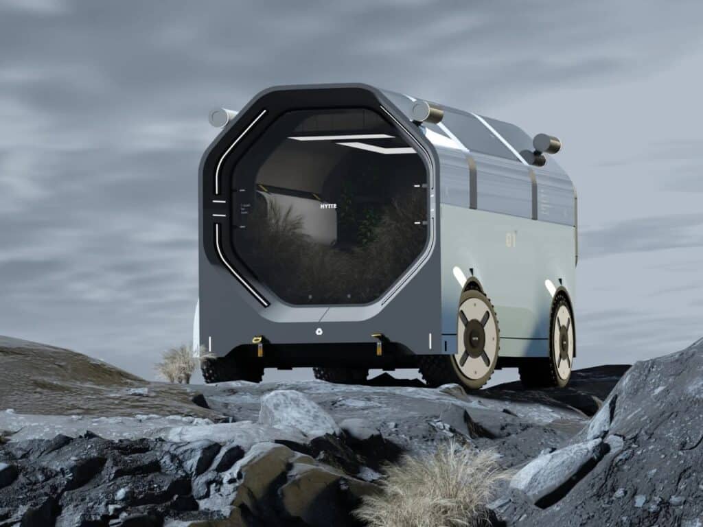 Front view of the HYTTE mobile home showcasing the large octagonal window and rugged tires.
