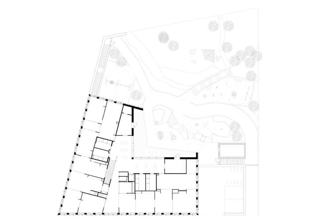 Architectural floor plan of Postiljooni Daycare Centre second floor showing the layout of classrooms and the integrated playground area.