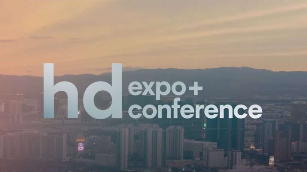 HD Expo + Conference showcasing hospitality design products, including furniture, lighting, and materials within a large exhibition environment.