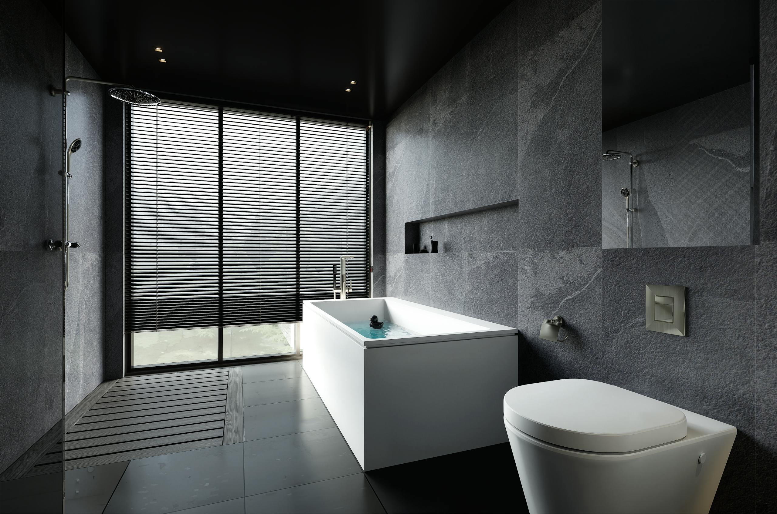Modern bathroom with dark stone tiles and freestanding bathtub