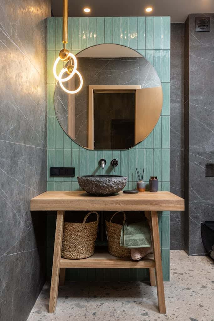 Stylish bathroom vanity with round mirror and elegant wall lighting