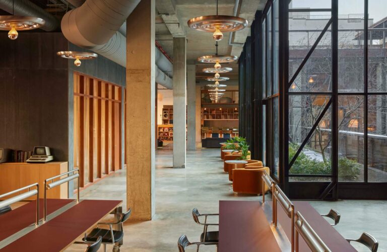 Rendering of the proposed Triumphal Arch in Washington, D.C., seen from street level with cars and pedestrians.