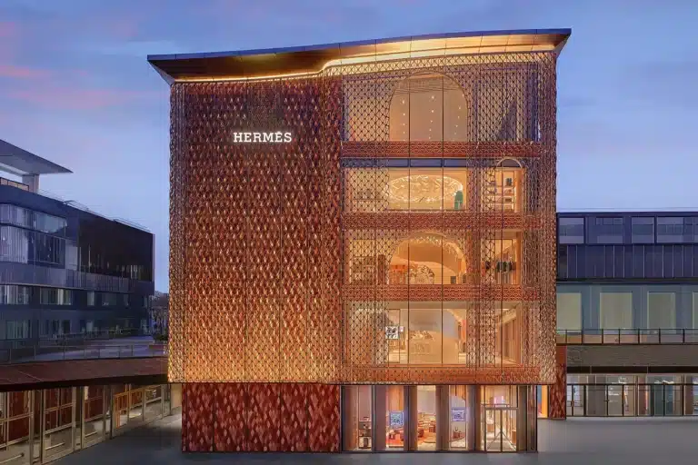 Side view of the Herm&egrave;s Beijing building, with the brand name visible on the ceramic facade.